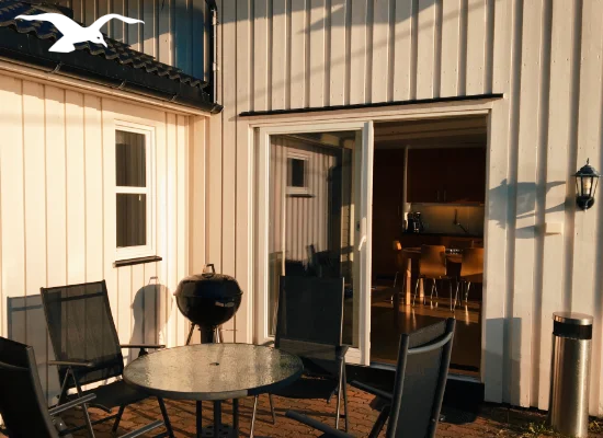 House for 7 persons outdoor balcony view at Hindrum Fjordsenter in Norway on sunny day