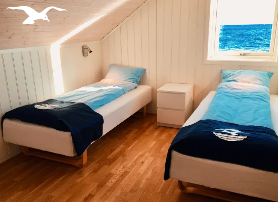 House for 10 persons bedroom south 3 view at Hindrum Fjordsenter in Norway on sunny day