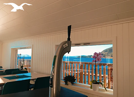 Indoor with a draft beer tap at the conference facilities 1 at Hindrum Fjordsenter in Norway at sunny day