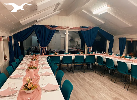 Banquet facilities 3 in pink at Hindrum Fjordsenter in Norway at night